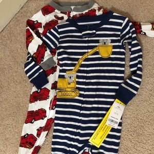 Two Carter’s Footie Pajamas